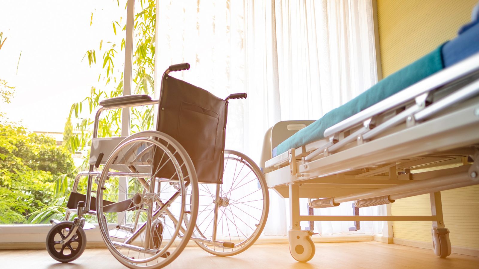 Image of wheelchair and hospital bed in a home